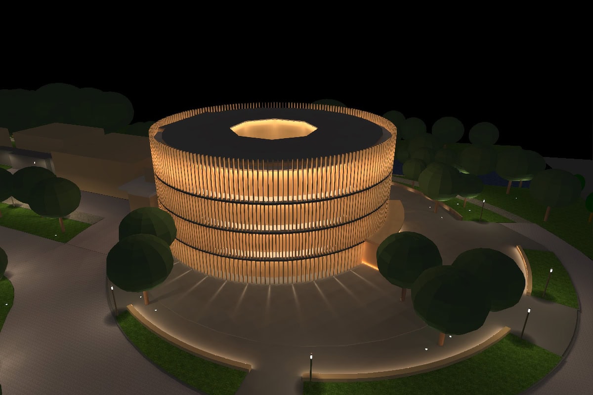 a building with a circular structure and trees